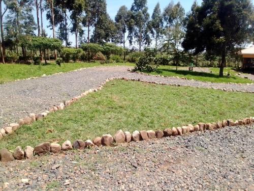 a row of rocks on the side of a road at Esniko Villa in Narok