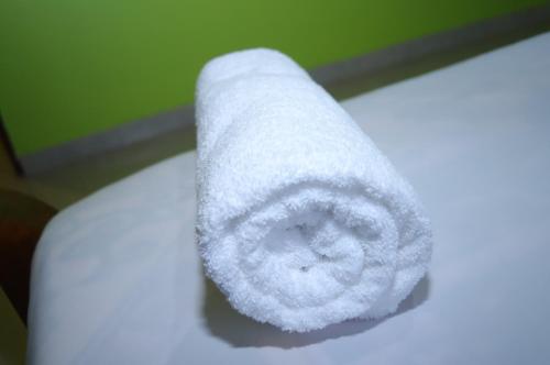 a roll of toilet paper sitting on top of a toilet at Esniko Villa in Narok