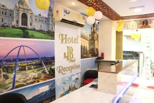 a hotel reception area with a sign for a hotel room at Hotel J B L in kolkata