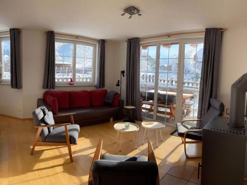 a living room with a couch and chairs at Apartment in Katschberg near Ski Slopes in Sankt Margarethen im Lungau