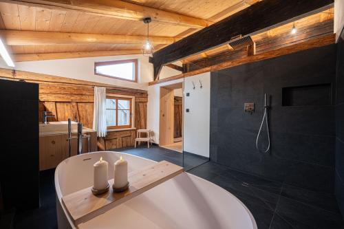 a bathroom with a white tub in a room at Ferienwohnung Lexar Hüs Oberstdorf in Oberstdorf