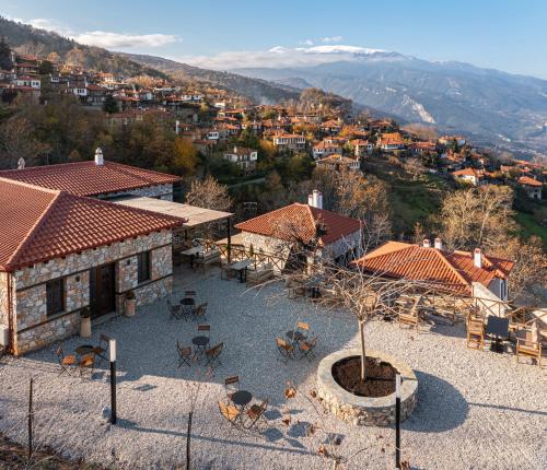 an aerial view of a building with tables and chairs at Unedo All Seasons Boutique Hotel in Palaios Panteleimon