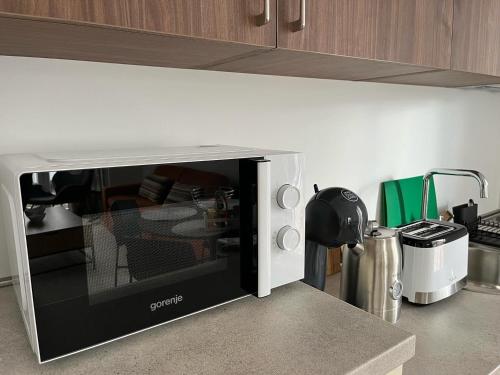 a microwave oven sitting on a counter in a kitchen at Stasa_cozy_nest in Kolašin