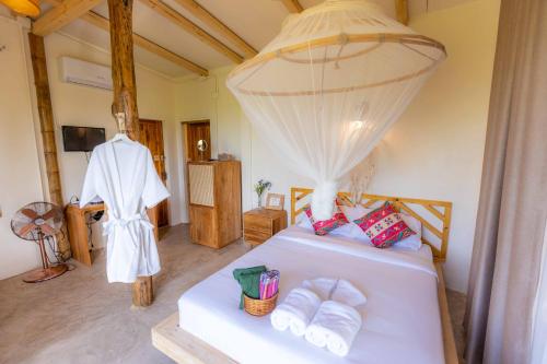 A bed or beds in a room at Nakhao Cottage