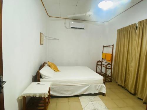 Ένα ή περισσότερα κρεβάτια σε δωμάτιο στο Rosemary House Kabalana