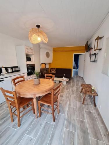 a kitchen and dining room with a table and chairs at Gite du bibicherat in Largillay-Marsonnay