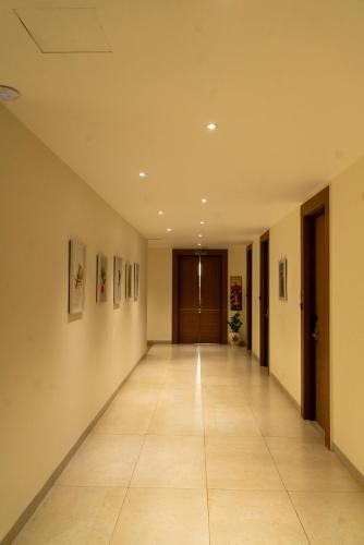 an empty hallway in a building at HOTEL ACHYUT in Tiruppūr
