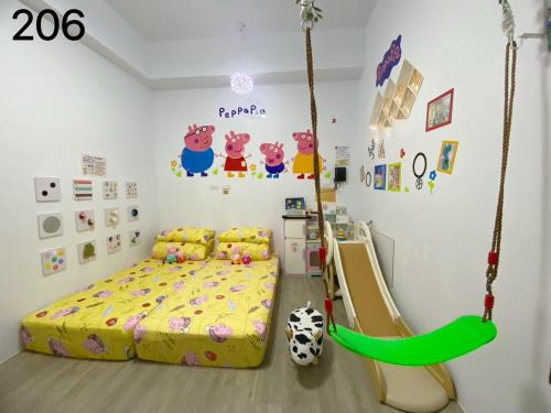 Postel nebo postele na pokoji v ubytování Wind Natural Parent-Child Inn II