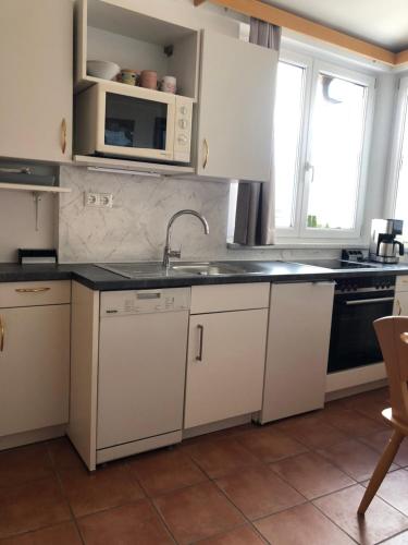 Kuchyň nebo kuchyňský kout v ubytování Appartment Isabelle Home
