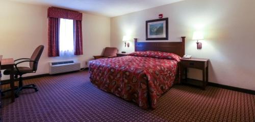Postelja oz. postelje v sobi nastanitve Mountain Inn & Suites Airport - Hendersonville