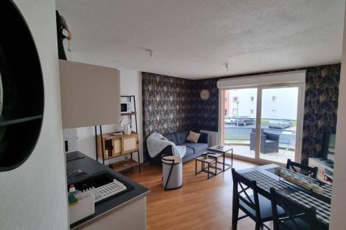 Posezení v ubytování Appartement avec parking privé