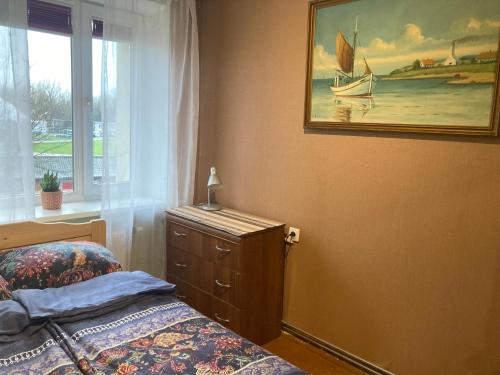 Ένα ή περισσότερα κρεβάτια σε δωμάτιο στο NOSTALGIA apartment
