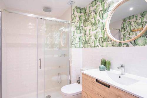 a bathroom with a shower and a toilet and a sink at Vivendos New y Luxury apartment city center in Torremolinos
