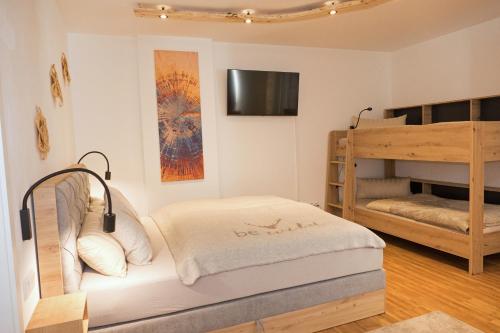 a bedroom with two bunk beds and a bunk bed at Appartement Rehlein in Mauterndorf