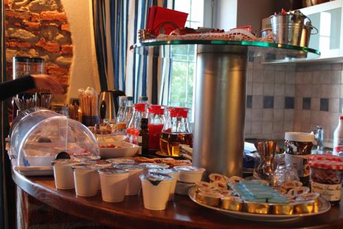 a table with food and drinks on top of it at Red Wine Camere in La Morra