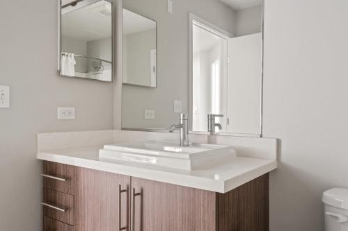 a bathroom with a sink and a mirror at Redwood City 1BR w Gym WD next to Caltrain SFO-1046 in Redwood City