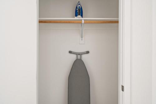 a surfboard hanging on a rack on a wall at Redwood City 1BR w Gym WD next to Caltrain SFO-1046 in Redwood City
