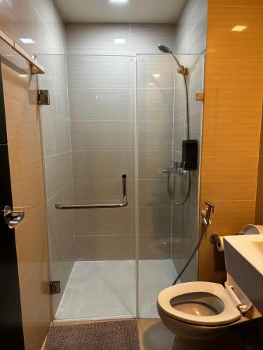 a shower stall in a bathroom with a toilet at 81 Newport Blvd Cluster 4 Unit B 3rd flr by Rechelle Nunag in Manila