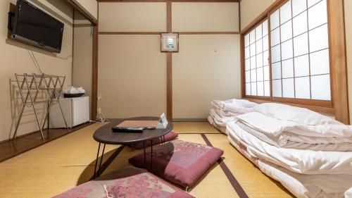 Tabist インターナショナルホテル皆生にあるテレビまたはエンターテインメントセンター