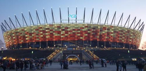 una multitud frente a un estadio de fútbol en CrackedBrick Warsaw Rentals en Varsovia