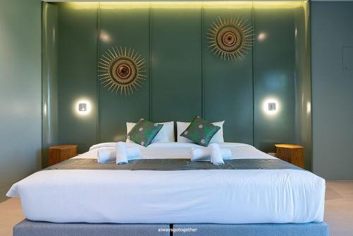 Postel nebo postele na pokoji v ubytování Pattanipirom Boutique Hotel