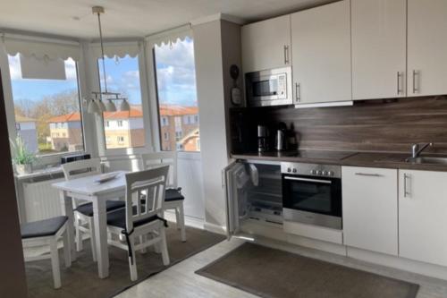 Kuchyň nebo kuchyňský kout v ubytování Seeschloss Wohnung 22