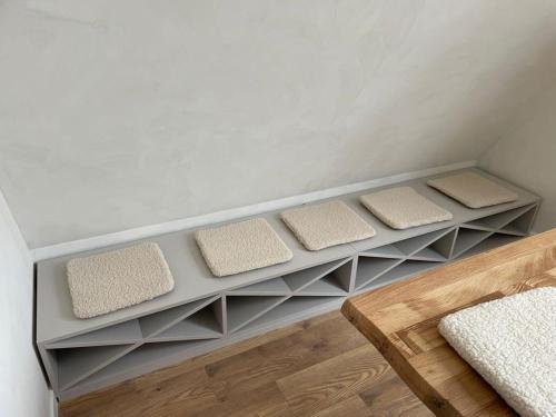 a room with three pillows sitting on shelves at GO Jahorina by Olympic Gardens in Jahorina