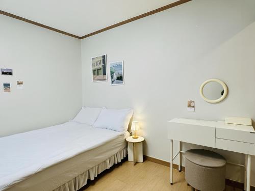 Ένα ή περισσότερα κρεβάτια σε δωμάτιο στο SSH Icon Hostel