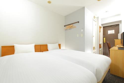 Кровать или кровати в номере HOTEL MYSTAYS Kameido