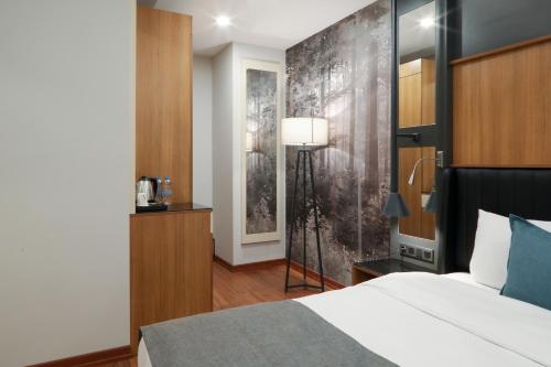 Postel nebo postele na pokoji v ubytování Expoist Hotel