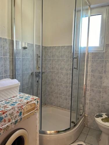 a bathroom with a shower and a toilet at Kuca za odmor Marija in Kupres