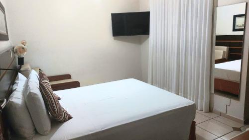 Postel nebo postele na pokoji v ubytování Hotel Ferraz