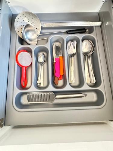 a drawer filled with utensils in a refrigerator at "Seaside Studio with Stunning Views in Belyounech in Belyounech 