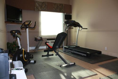 a room with two exercise bikes and a window at Days Inn by Wyndham Berthierville in Berthierville
