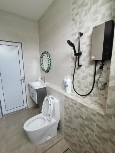 a bathroom with a white toilet and a shower at La Belle Maison 12 @ Gurney Kelawai/Pulau Tikus/Georgetown in George Town