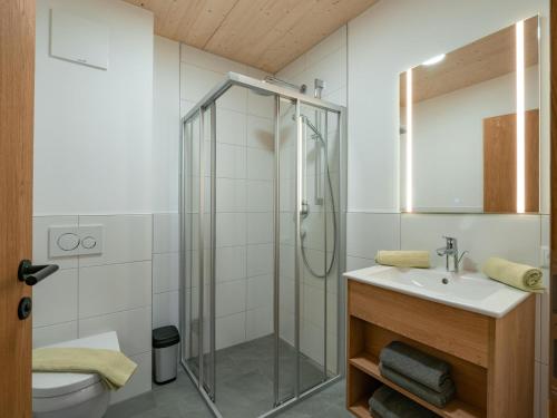 a bathroom with a shower and a sink at M&M Appartements Brixental in Westendorf