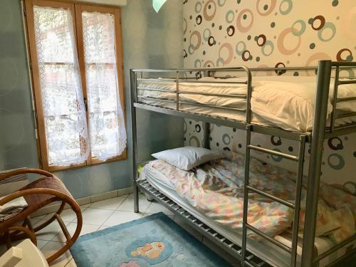 a bedroom with two bunk beds in a room at Pleine Mer in Yport