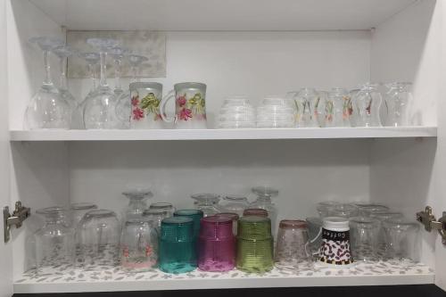 a bunch of glass jars sitting on a shelf at Engin HOME in Pamukkale