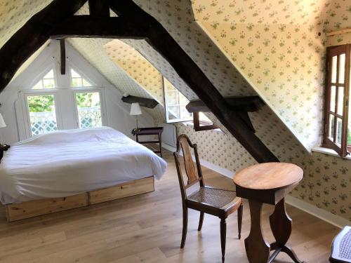 Ένα ή περισσότερα κρεβάτια σε δωμάτιο στο Petit Clos