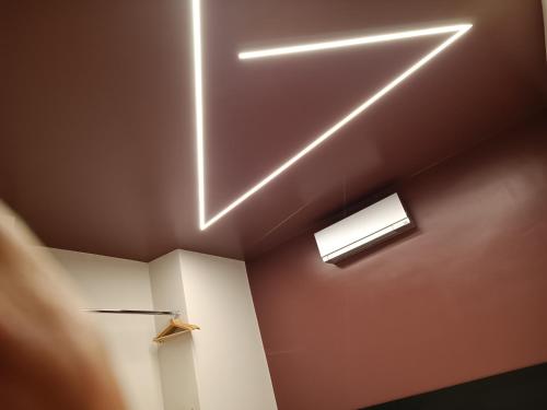 a room with two lights on the ceiling at Le dimore di Megollo - Free Parking in Genova