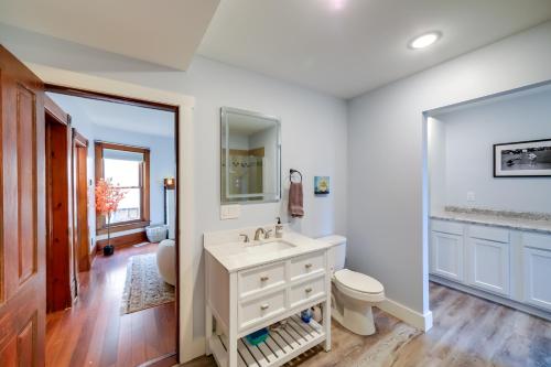 a bathroom with a sink and a toilet at Spacious Rockford Retreat Walk Downtown! in Rockford