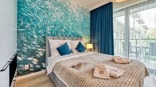 Postel nebo postele na pokoji v ubytování Rezydencja Niechorze 213 - 5D Apartamenty