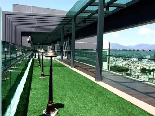a view from the roof of a building with green grass at JS Ipoh Homestay @ The Majestic Ipoh in Ipoh