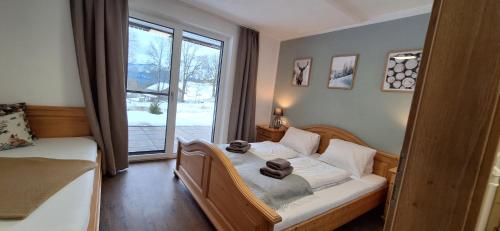 a bedroom with a bed and a window at MottHof in Lermoos