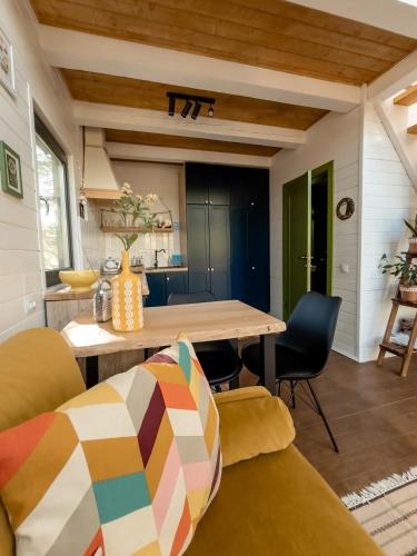 a kitchen and living room with a table and chairs at Chili Shale in Yablunytsya