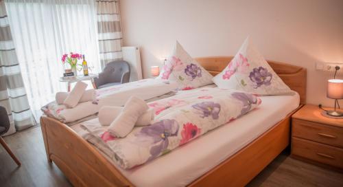 a bed with two pillows on top of it at Weingut Erich Serwazi in Mesenich