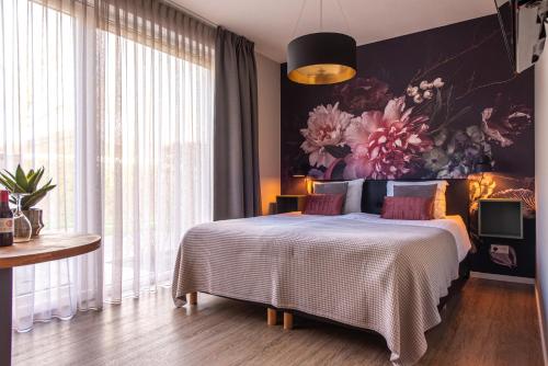 Giường trong phòng chung tại Villa Zoutelande