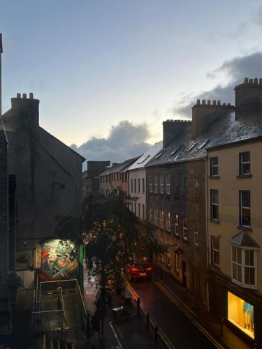 a view of a city street with buildings at Buttermilk Walk Room in Galway