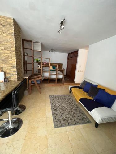 a living room with a couch and a table at Lomas de las Mercedes in Caracas