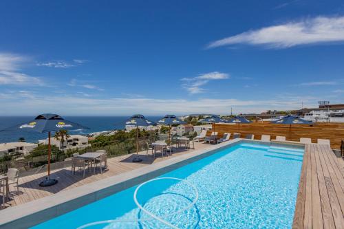 a swimming pool with a view of the ocean at Plett Quarter Hotel - Lion Roars Hotels & Lodges in Plettenberg Bay